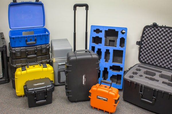 Molded plastic hard cases with foam cushioning